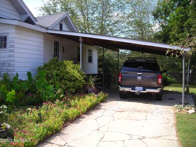 Rear with attached carport