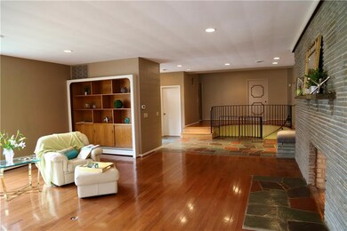 Built-in bookshelves and cabinets flank the grand 