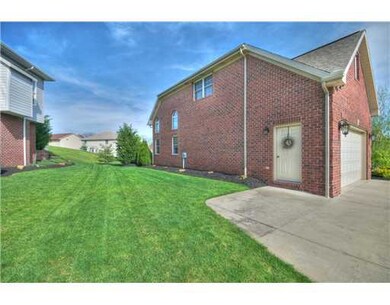Exterior Front. garage man door.  Two sides brick.