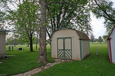 Large shed for storage. Lot backs to the Golf cour