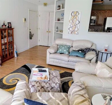 Living room with storage closet in entry