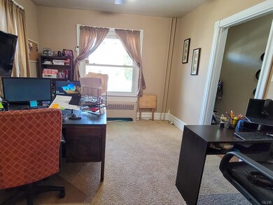 The front room is being used as an office and is l