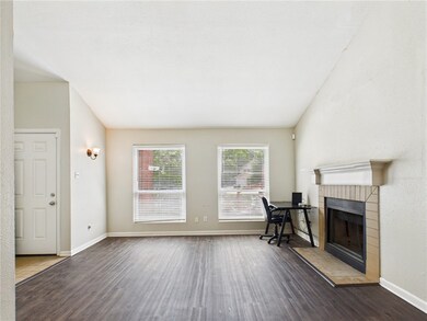 Living room featuring wood finished floors, a tile