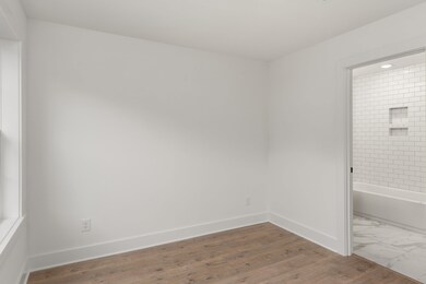 First floor bedroom with full bathroom *Photo not of actual home- construction to begin soon!!*