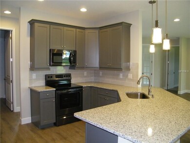 Granite countertops, wood cabinets with soft close