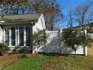 Front entry thru the vinyl privacy fence with lock