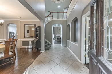 Coming through the front door you will be greeted by elegance and taste. A formal dining room is to your left, private study to your right and the two-story living room is just ahead.