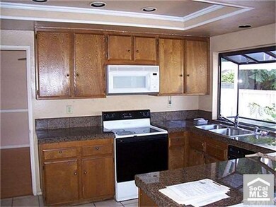 Granite counter tops in bright open kitchen