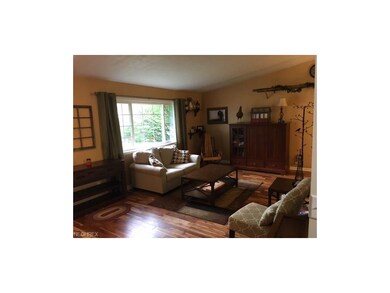 Living room has brand new wood flooring.