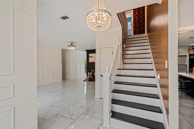 Stairs with a chandelier