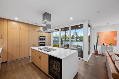 Kitchen with open floor plan, beverage cooler, da