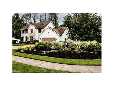 Gorgeous landscaping outlines the double driveways