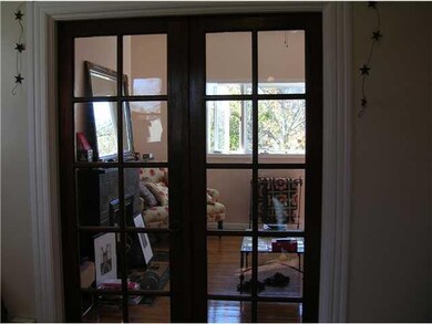 Living Room. Upper unit features lovely French doo