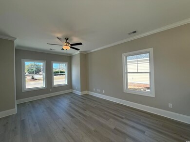 Spare room featuring crown molding, visible vents,