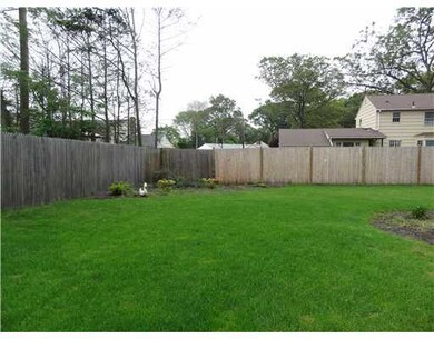 Exterior Back. fenced on 2 sides, beautiful lawn,