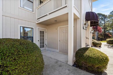 Property entrance with a balcony