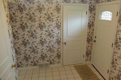 2 closets in foyer