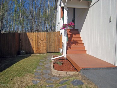 entry stairs, fence has gate