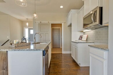 Barn door to mud room and garage entrance