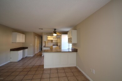 living room view to kitchen
