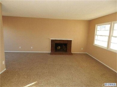 Nice Family Room with Fireplace and Lots of Light