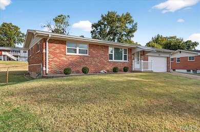 Ranch-style house featuring brick siding, an attached garage, and concrete driveway