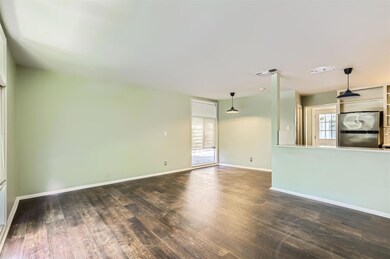 Unfurnished living room with dark wood finished f