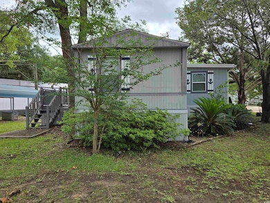View of side of property with stairway