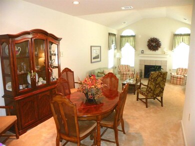 Open to living room and kitchen.