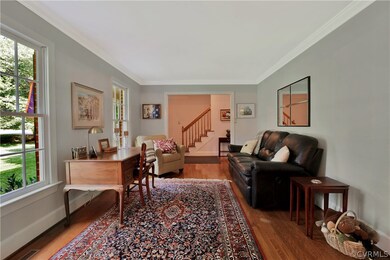Crown moulding throughout living room.