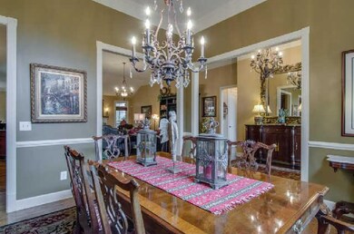 Dining room opens to foyer, living room, and kitch