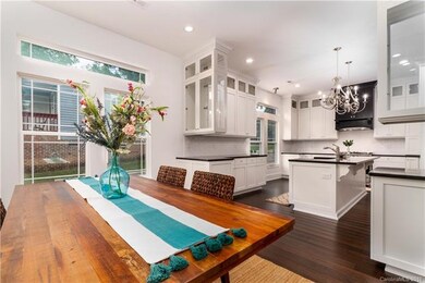 Huge kitchen opens to bright and airy dining space