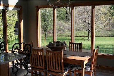 Large eat-in kitchen area with windows and sliding