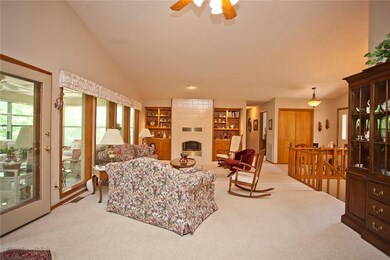 Main level living room. This is a spacious room with plenty of space for multiple seating options! This open space has a wall of windows that provide plenty of natural light!