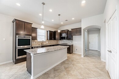 Kitchen equipped with Double ovens, Gas Range, dis