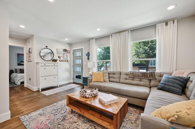 Living room with baseboards, recessed lighting, a