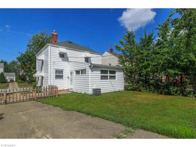 View of back of house. Yard is fenced in.