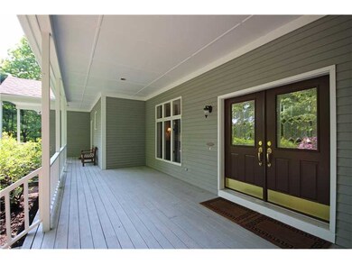 Porch. The covered front porch is 11  wide and 38  long, roomy enough for 2 seating areas. The double front doors make for a grand entrance into the front foyer. The secondary entrance at the left end of the porch leads to the side hallway near the garage.