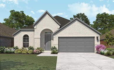 French country inspired facade featuring brick si