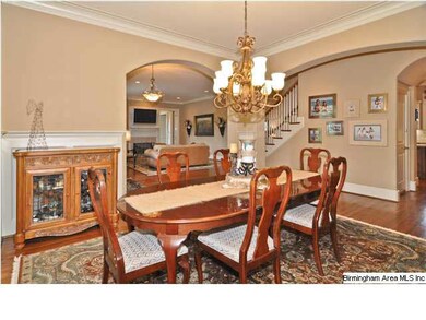 Spacious dining room with beautiful chandelier can
