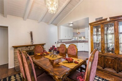 Large dining room with wood-burning fireplace and vaulted ceilings!