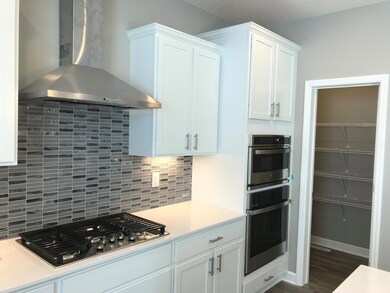 luxurious kitchen with double ovens and gas cooktop for all your holidays!.jpg