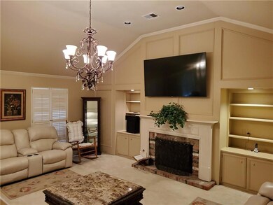 Living room features unique ceiling, gas log firep