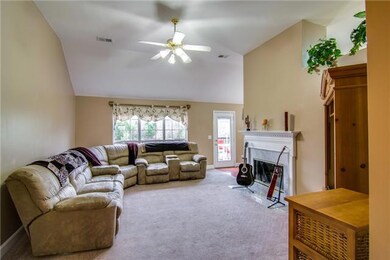 Enjoy the large living room area with a fireplace!  Plenty of room for all your entertaining or just hanging with your family!
