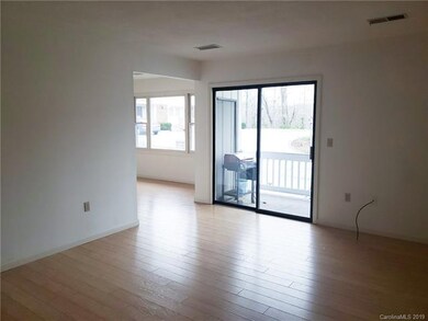 Living Room looking into Dining Room and Front Bal