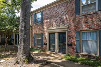 Doorway to property with brick siding