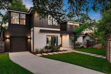 Contemporary home featuring driveway, a garage, a