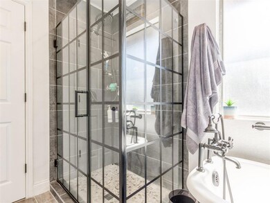 Main Bathroom with walk in glass enclosed shower.