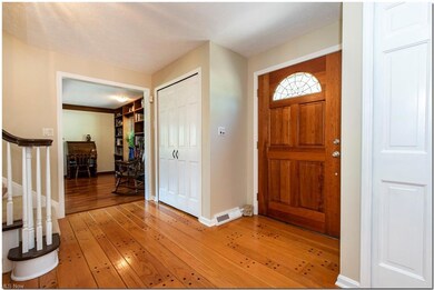 Foyer entry with hardwood flooring