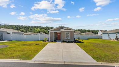 View of front of home featuring board and batten siding and cooling unit